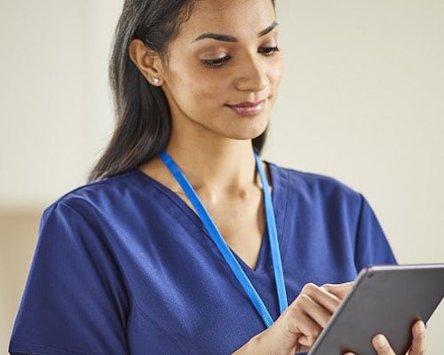 Clinician holds tablet